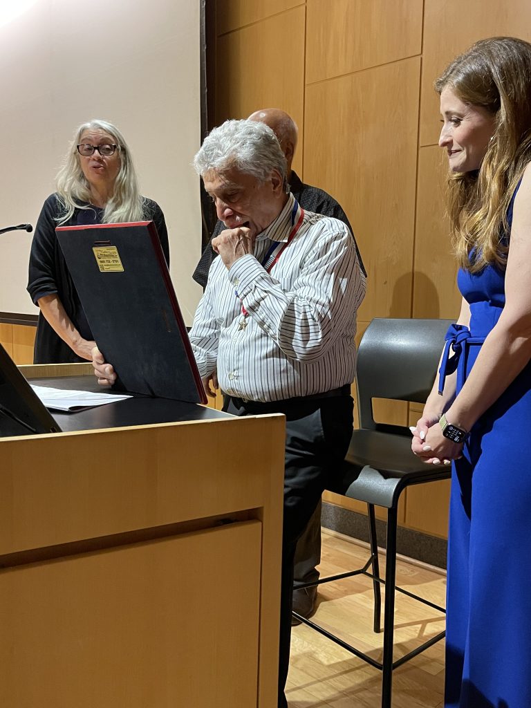 Sgt. Julio A. Feliu (center) gets emotional on receiving his Medgar Evers College Special Recognition Award as Dr. Rosalina Diaz (far left), friend Antonio (near left) and presenter Sonia Rincón (far right) look on.